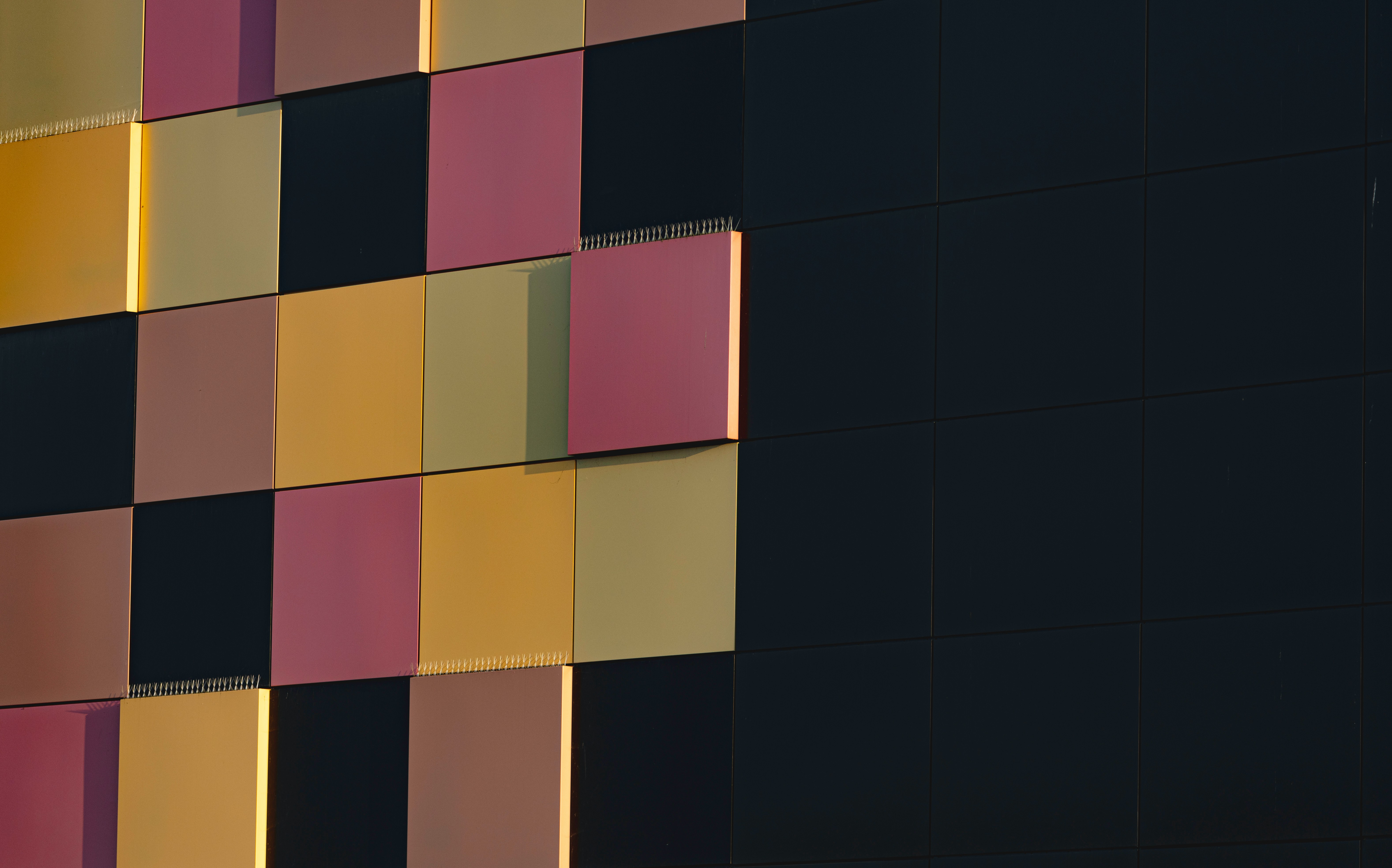 Two people work on installing a quantum processor into a dilution refrigerator.